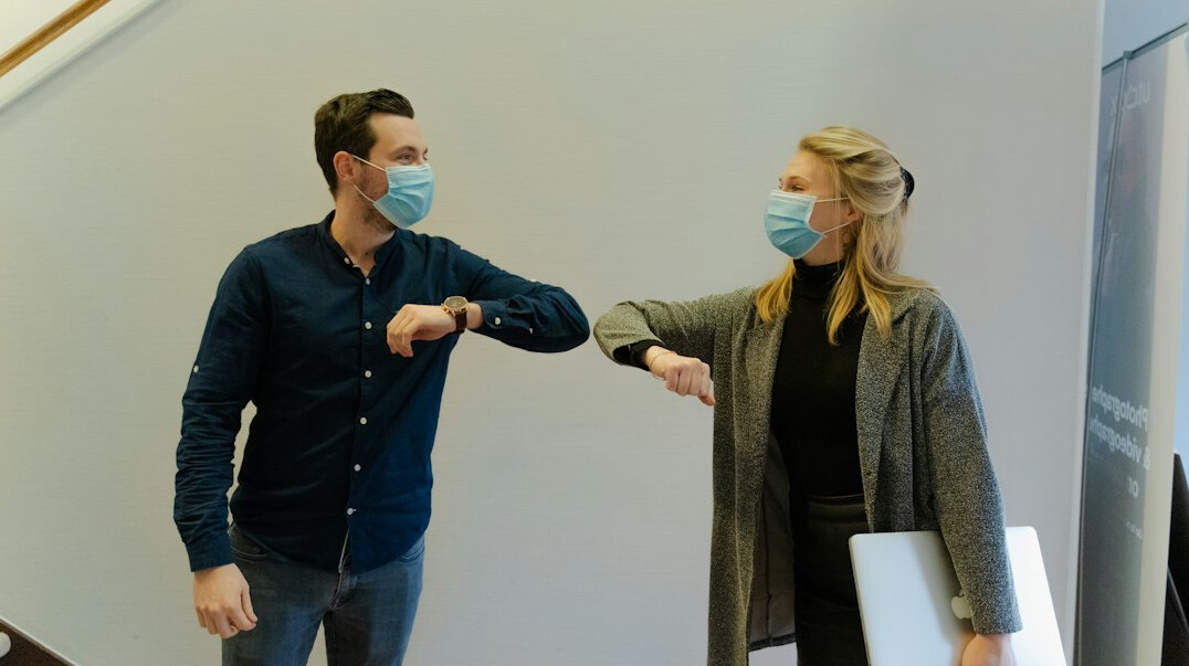 business people shaking hands in office